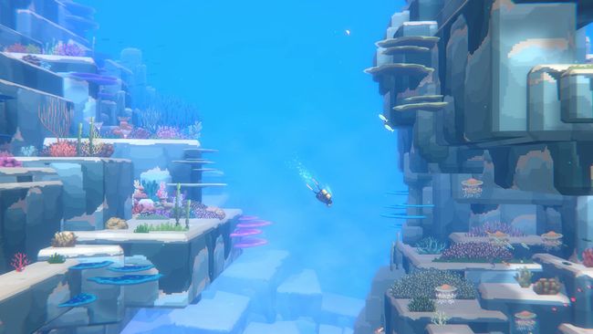 Captura del juego, se ve a Dave buceando en la Fosa Azul, el suelo lleno de corales y algunos peces alrededor